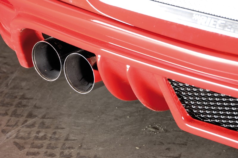 Achteraanzet met uitsparing voor enkele einddemper links Opel As